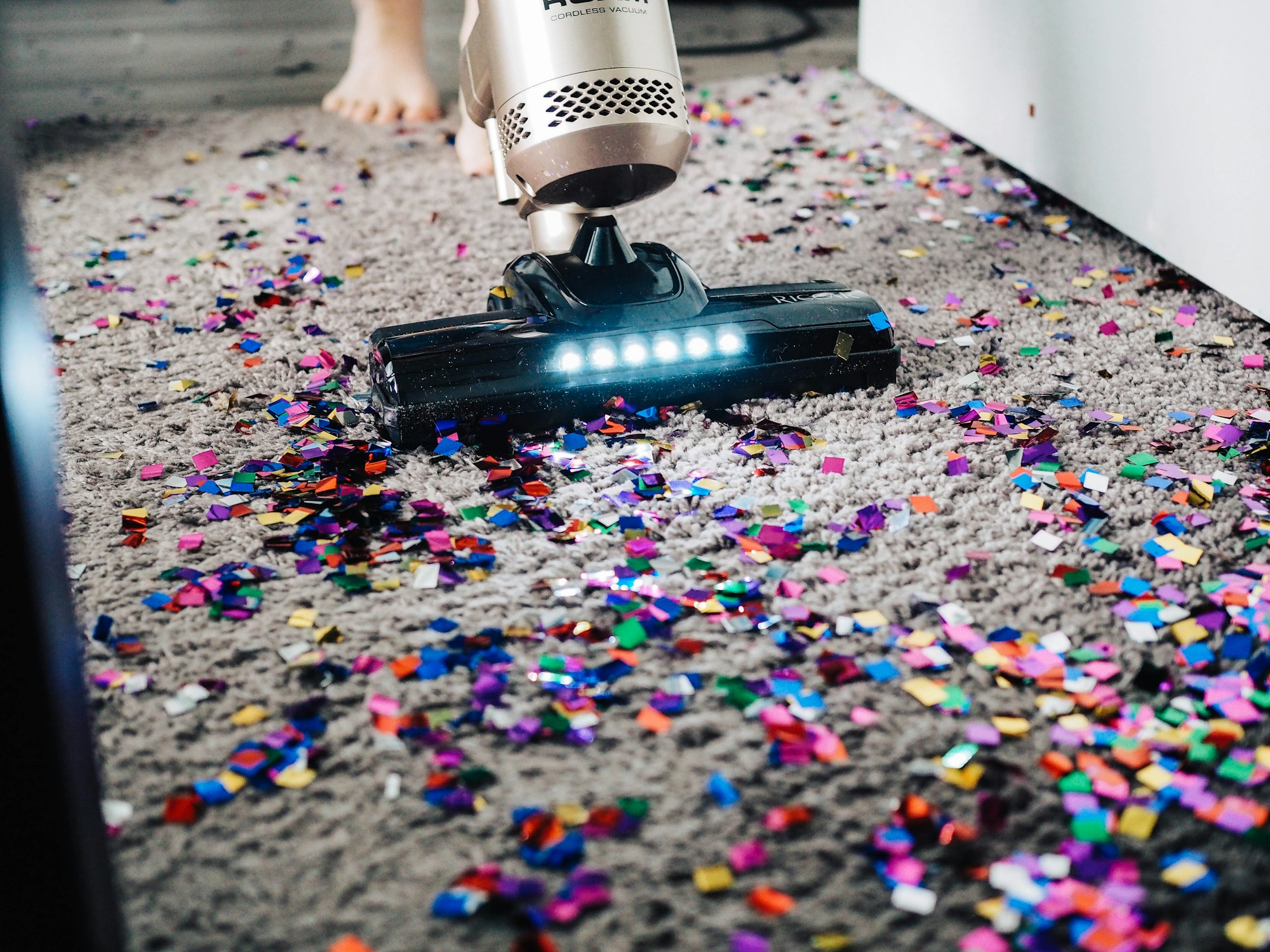 Professional carpet cleaning with a vacuum on fresh carpet